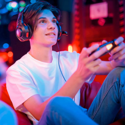 A guy playing game on console, wearing headset